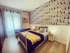 Un pat sau paturi într-o cameră la B&B Casa Bianco Roma