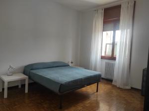 A bed or beds in a room at Casa Berizzi - Santa Lucia
