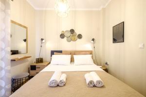 Кровать или кровати в номере Oreon Suites - 'Areti'