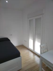 CASTRO Suites Osuna客房内的一张或多张床位