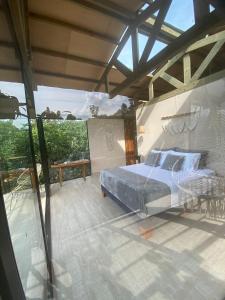 Ein Bett oder Betten in einem Zimmer der Unterkunft Glamping Entrearboles - Bellavista