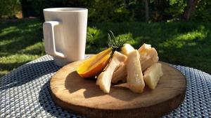a wooden cutting board with slices of fruit on a table at Kwetu Home - Sagana PAY BEFORE ARRIVAL in Sagana