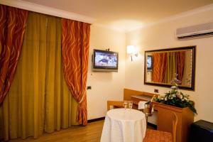 TV a/nebo společenská místnost v ubytování Hotel Ares