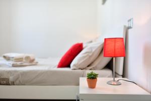 Postel nebo postele na pokoji v ubytování casa perla marina