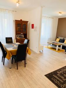 a living room with a table and chairs and a couch at Apartments Casa Toni Dubrovnik in Dubrovnik