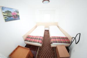 מיטה או מיטות בחדר ב-Chalets & Rooms Čarda Šebešfok