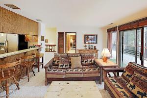 a living room with a couch and a table at High Meadows Retreat in South Lake Tahoe