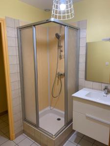 Ванна кімната в Chambres d’hôtes « Les sorbiers »