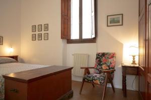 A bed or beds in a room at Roommo Viuzzo delle Canne