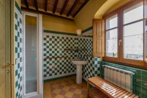 a bathroom with a sink and a toilet at Residence Le Santucce in Castiglion Fiorentino
