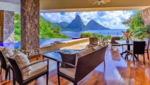 a dining room with a view of the ocean at Jade Mountain in Soufrière