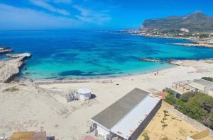 an aerial view of a beach with the ocean at Stabilimento Lido Burrone in Favignana