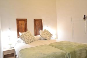 מיטה או מיטות בחדר ב-SunShine Cordoba Central