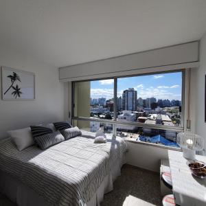 Postel nebo postele na pokoji v ubytování Península de Punta, apartamento aconchegante com bela vista mar