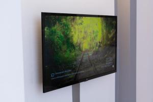 A television and/or entertainment centre at GiNa Guest House