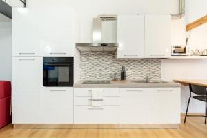 A kitchen or kitchenette at GiNa Guest House