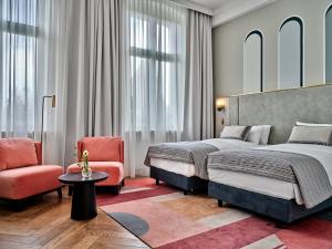 Łóżko lub łóżka w pokoju w obiekcie Hotel Altus Palace - Destigo Hotels