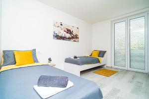 Posteľ alebo postele v izbe v ubytovaní Porto new Dubrovnik