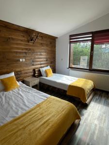 A bed or beds in a room at Belvedere Hills