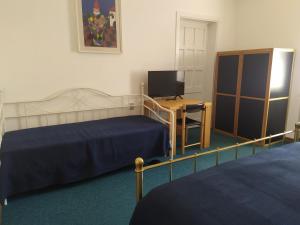 Postel nebo postele na pokoji v ubytování Doge Inn