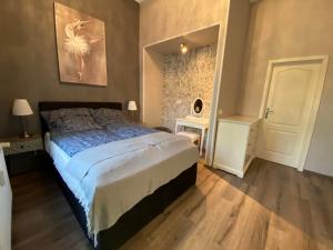 Ένα ή περισσότερα κρεβάτια σε δωμάτιο στο K&S Apartments