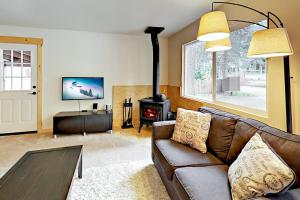 a living room with a couch and a wood stove at Miztec Manor in South Lake Tahoe