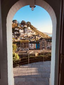 a view of a city through an archway at Harbour House Looe in Looe