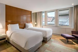 a hotel room with two beds and a window at Radisson Blu Bosphorus Hotel in Istanbul