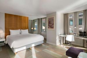 a bedroom with a large bed and a large window at Radisson Blu Bosphorus Hotel in Istanbul