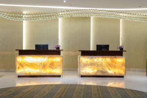 a lobby with two podiums in a building at Radisson Blu Hotel, Jeddah Al Salam in Jeddah