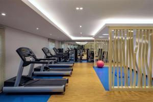 a row of exercise equipment in a fitness room at Radisson Blu Hotel, Jeddah Al Salam in Jeddah