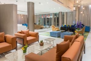 a lobby with couches and a waiting room at Radisson Blu Hotel, Jeddah Corniche in Jeddah