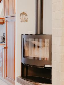 a television in a living room with a fireplace at La Casa di Ele Home Sweet Home Viterbo in Sutri +17 photos
