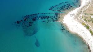 an aerial view of an island in the ocean at Makara Case Vacanza in Eraclea Minoa