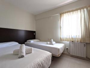 Posteľ alebo postele v izbe v ubytovaní ClassBedroom Gothic Ramblas Apartments