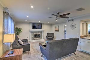 a living room with two couches and a fireplace at Las Vegas House with Pool and Hot Tub - 1 Mi to Strip! in Las Vegas