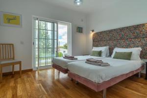 Giường trong phòng chung tại LV Premier Algarve FU1- pool, AC, garden, sea view