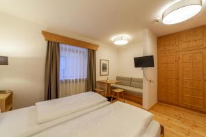 Letto o letti in una camera di Hotel Greif