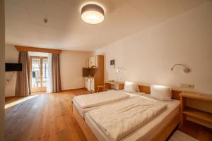 Letto o letti in una camera di Hotel Greif