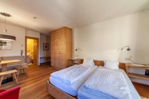 Letto o letti in una camera di Hotel Greif