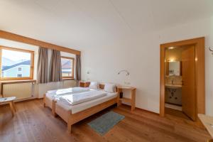 Letto o letti in una camera di Hotel Greif
