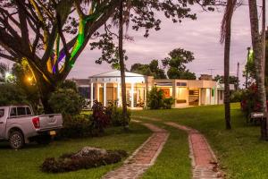 a truck parked in front of a house at Finca Termópilas in Rivera