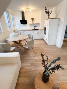 TV a/nebo společenská místnost v ubytování Dyke Appartements