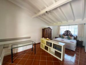 Postel nebo postele na pokoji v ubytování Hotel Spa Posada Tlaltenango