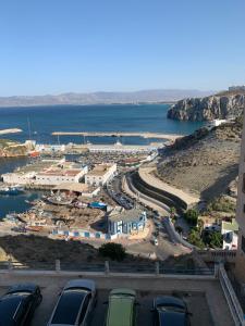a view of a harbor with cars parked in a parking lot at Almarsa4 in Al Hoceïma