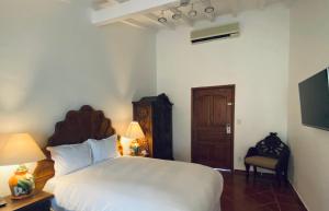 Postel nebo postele na pokoji v ubytování Hotel Spa Posada Tlaltenango
