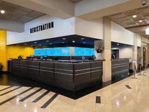 a lobby with a reception counter in a hotel at Plaza Hotel & Casino in Las Vegas +37 photos