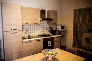 a kitchen with a table with a bowl on top of it at CASA FRANCY in Castelmola