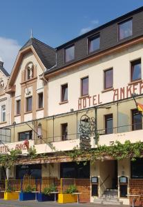 a hotel on the corner of a street at Hotel Anker in Kamp-Bornhofen