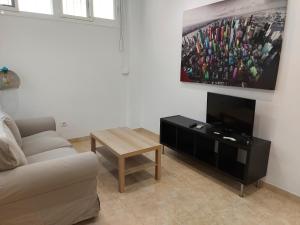 Televízia a/alebo spoločenská miestnosť v ubytovaní Loft Escobar